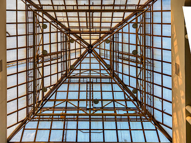 istock Image shows an architectural interior with a geometric lattice structure, filled with natural light and potentially part of a transportation hub No people are present The photograph captures the de 2204521962