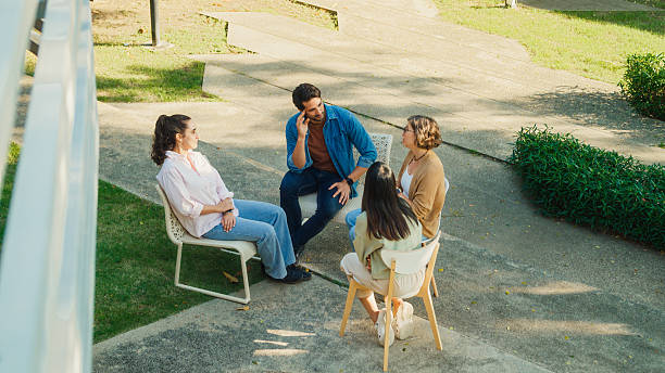 istock Top view diverse group people participating in outdoor community therapy session focused on mental health awareness and support sharing advice to promote empathy togetherness. Mental health concept. 2204522774