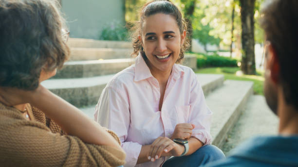 istock Diverse group people participating in outdoor community therapy session focused on mental health awareness and support sharing advice to promote empathy togetherness. Mental health concept. 2204522789