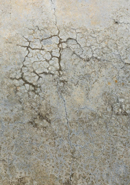 Old layers of Weathered and cracked concrete raw building wall, modern original texture background. Unfinished dirty with many imperfections. Design elements often used pattern in interior and building architecture. Good material and abstraction as background \