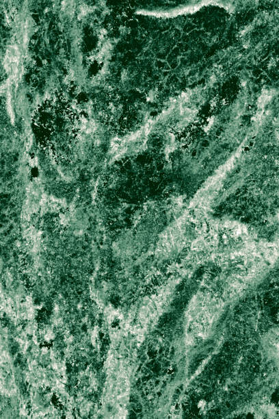 istock Real closeup of dark green marble stone texture surface background. Design pattern with high resolution for luxury home decoration. Abstract matt slab rock material. Front view of natural tiles stone surface. 2204536016