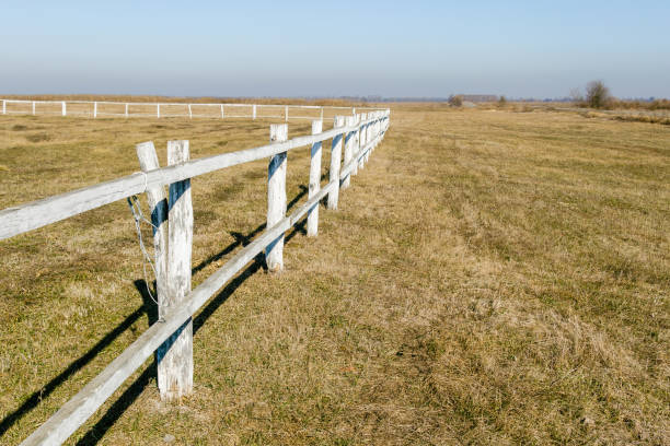 istock Rustic Wooden Fence in Dry Open Field 2204536172