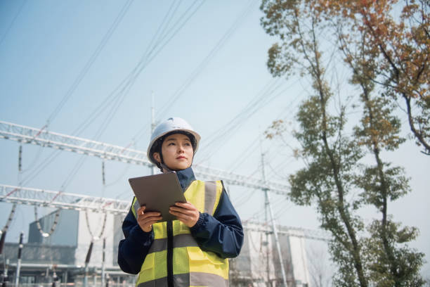istock Female engineer`working on the power station with digital tablet 2204536208