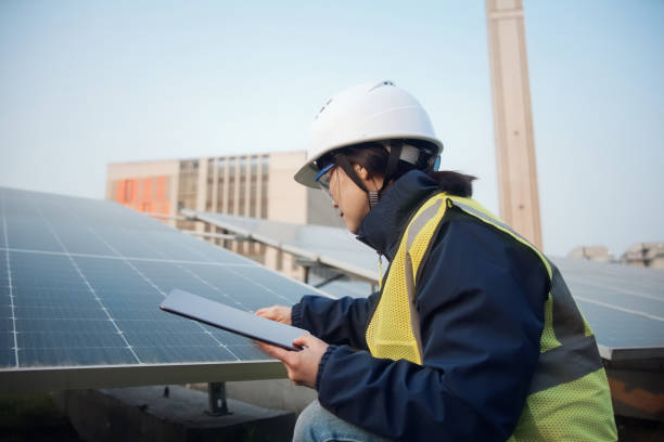 istock asian female engineer working with digital tablet in solar power station 2204536619