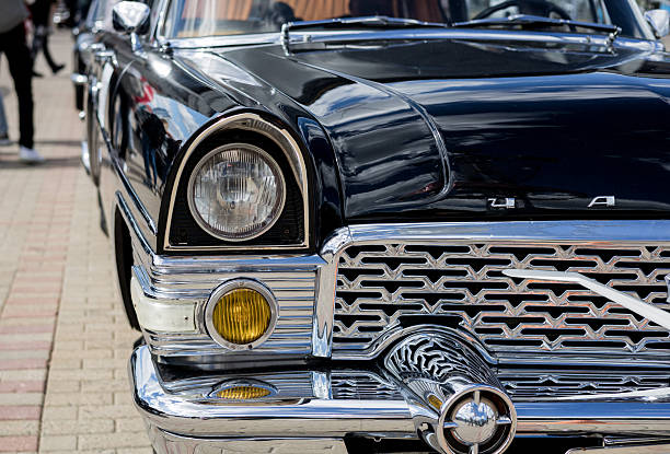 Close up details of Antique American Classic Cars create beautiful and colorful geometric designs.