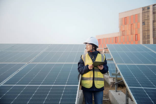 istock asian female engineer working with digital tablet in solar power station 2204536738