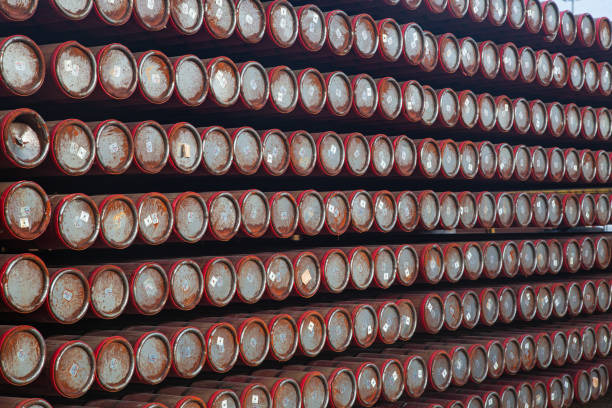 New steel pipes stacked in a warehouse.