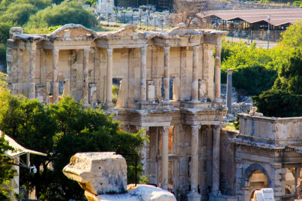 Tourists on the ancient Marble Street leading to the Celsus Library in Ephesus. Oct 25, 2023. Selcuk, Izmir, Turkey (Turkiye)