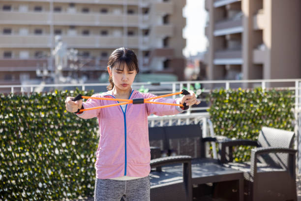 young pretty brunette woman outside making sport exercises on training playground, lifestyle people concept close up