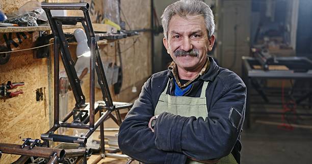 istock An artisan stands in a workshop filled with tools and equipment for crafting and design 2204539757
