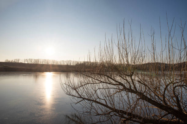 Winter sunset over a calm frozen lake