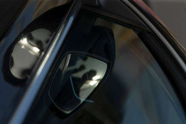 istock This is a close up observation of a rear view mirror located on a car window 2204542744