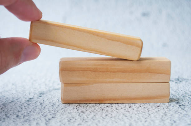 istock Hand holding wooden block with customizable space for text. Copy space concept 2204543371