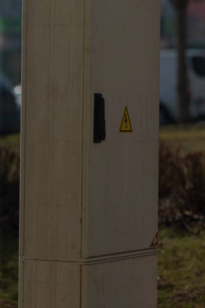 istock A box with a yellow triangle is sitting in the grass 2204545099