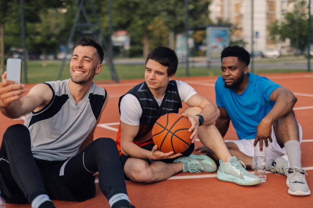 istock Three basketball players taking selfie after training session 2204546079