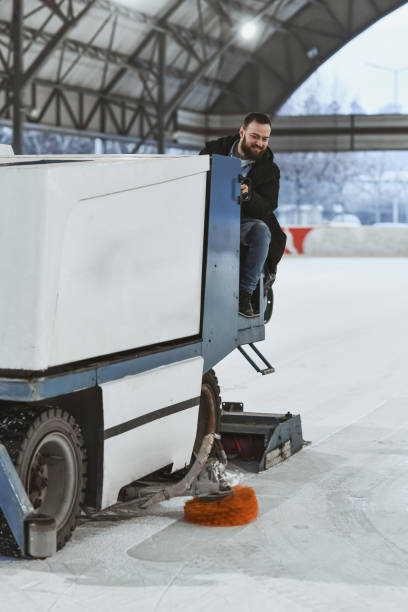 istock Joyful Ice Rink Employee Operating Resurfacing Equipment 2204546494