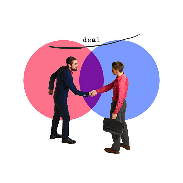 istock Business handshake over overlapping circles after deal closure. Common ground, successful partnership 2204546632