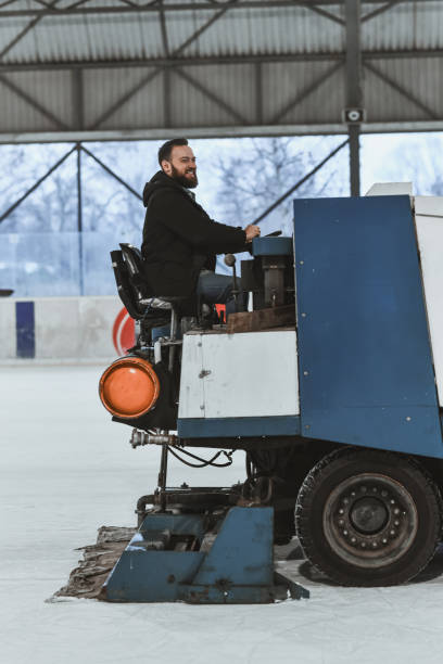 istock Content Ice Skating Rink Staff Operating Resurfacer Machine 2204546731