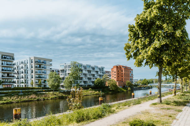 istock Modern Riverside Apartments and Greenery in a Scenic Urban Setting 2204548275