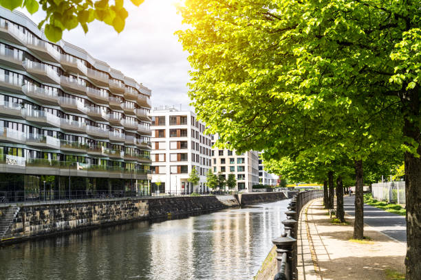 istock Modern Riverside Apartments in Berlin Surrounded by Trees and Sunshine 2204548618