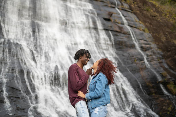 istock Couple in love at a waterfall 2204549052