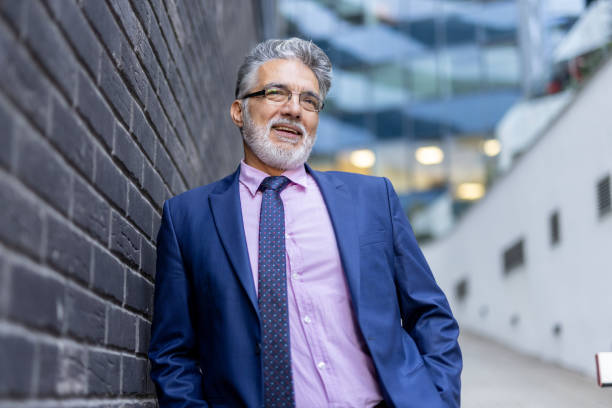 istock Experienced Businessman Smiling in a Modern Setting 2204549125