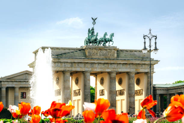 istock Brandenburg Gate in Berlin With a Blooming Foreground on a Sunny Day 2204549217