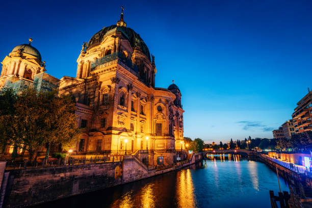 istock Illuminated Cathedral at Twilight, By the Spree River in Berlin, Germany 2204549802
