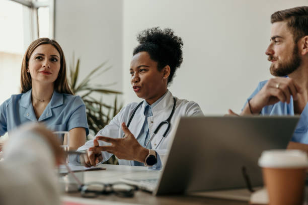 istock Group of hospital workers having a meeting 2204549994