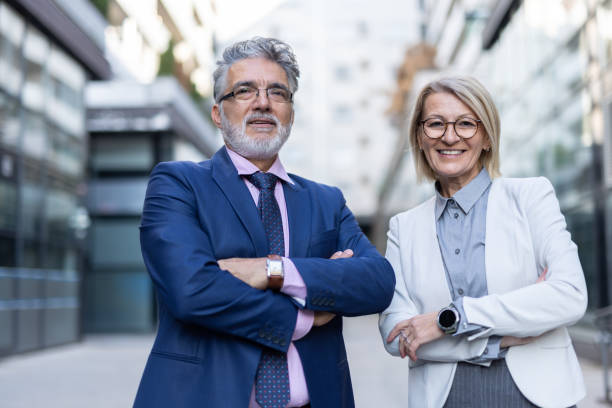 istock Friendly business duo smiling with confidence outdoors 2204550161