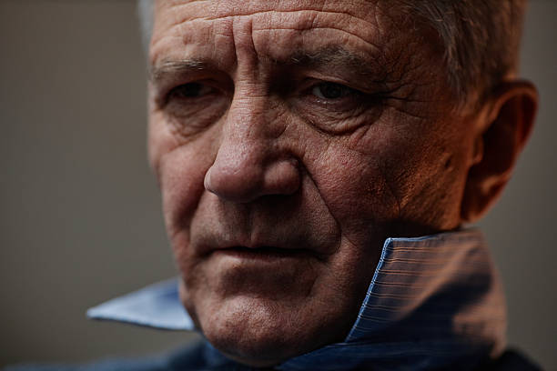 istock Portrait of Elderly Man Reflecting in Natural Light 2204551276