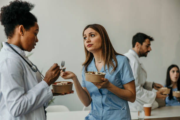 istock Doctor and nurse enjoying meal together 2204551476