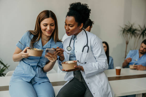 istock Doctor and nurse enjoying meal together 2204551480