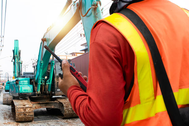 istock Engineers use radio communication devices to control the operation of machine operators. 2204551749