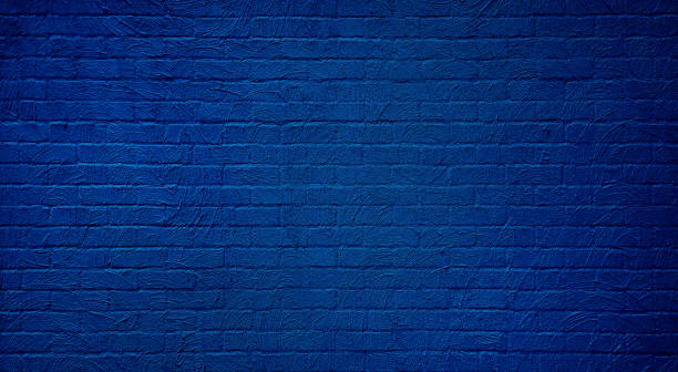 istock a clean, textured blue plaster brick wall provides a neutral and versatile background for various design purposes. abstract weathered texture stained old stucco dark blue brick wall background. 2204553069