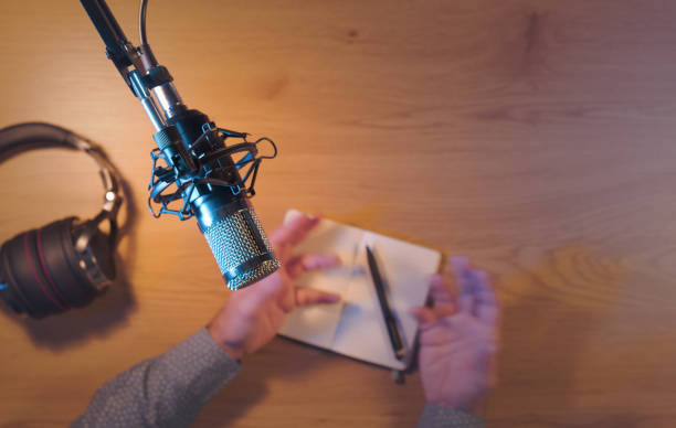 istock Content creator livestreaming a podcast in the studio 2204554819