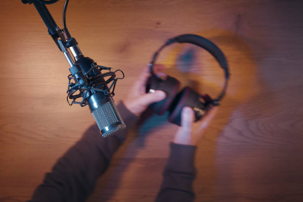istock Content creator livestreaming a podcast in the studio 2204555718
