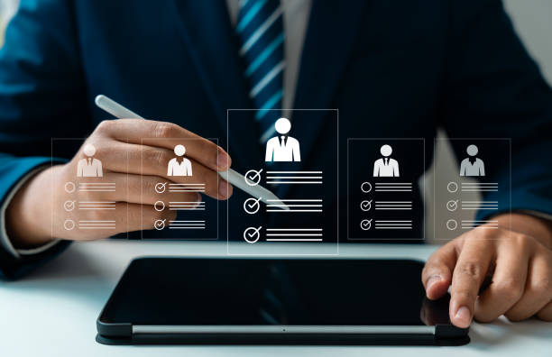 istock Human resource technology, HR recruitment and team management, Human resource manager reviewing online CVs to select perfect candidate for employment using digital technology and networking tools 2204555914
