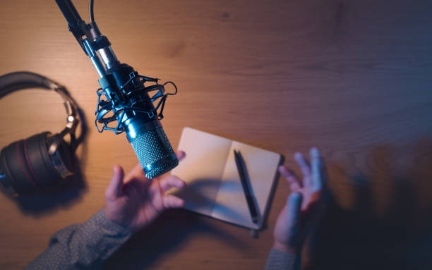 istock Content creator livestreaming a podcast in the studio 2204555963