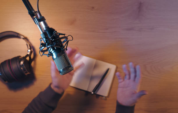 istock Content creator livestreaming a podcast in the studio 2204556182