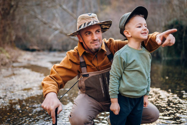 istock Two cute fishermen 2204556415
