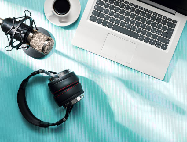 istock Content creator desk with laptop and audio equipment 2204556466