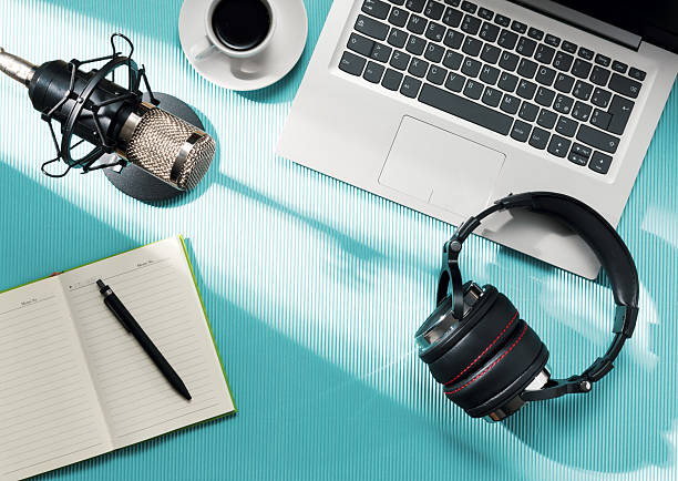 istock Content creator desk with laptop and audio equipment 2204556772