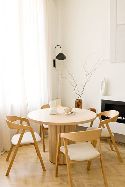 istock Round wooden table and chairs 2204559082