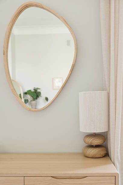 istock Lamp and mirror on wooden table 2204559134
