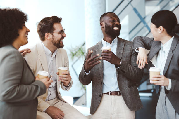 istock Happy colleagues having a coffee break in an office 2204559452