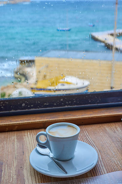A cup of coffee with a sea view