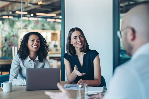 istock Two businesswomen leading a meeting with a client 2204561365