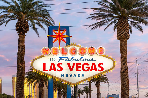 Las Vegas, USA - Sep 22, 2019: A Las Vegas blvd street sign early in the evening with the Caesars hotel in the background.