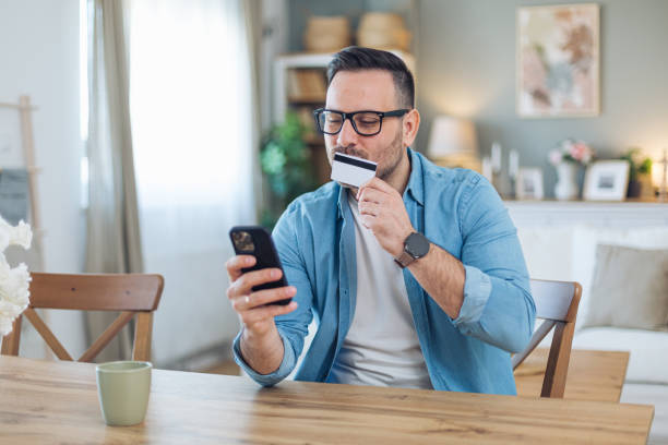 istock Man kissing credit card 2204564551